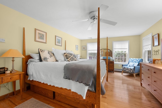 95 Red Brook Rd, Waquoit, MA 02536 - bedroom featuring light wood-style floors, ceiling fan, and a baseboard heating unit