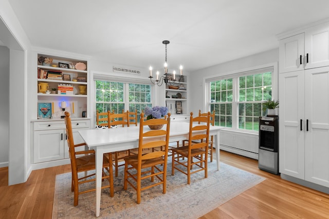 95 Red Brook Rd, Waquoit, MA 02536 - dining area featuring a chandelier, plenty of natural light, a baseboard radiator, and light wood finished floors
