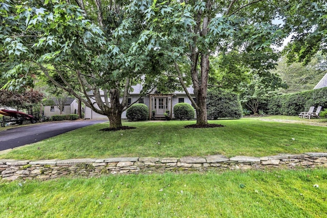 37 Tobisset St, Mashpee, MA 02649 - obstructed view of property featuring asphalt driveway and a front yard