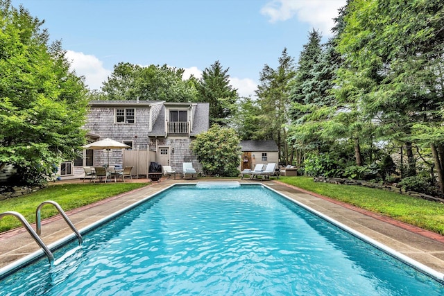 37 Tobisset St, Mashpee, MA 02649 - outdoor pool featuring a yard, a patio, a storage unit, and view of scattered trees