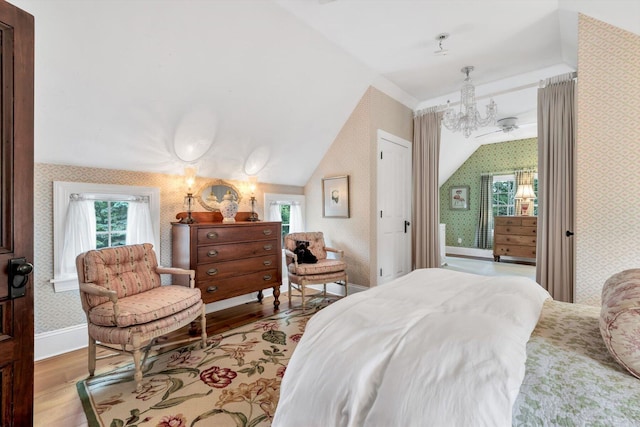 37 Tobisset St, Mashpee, MA 02649 - bedroom featuring wallpapered walls, wood finished floors, a chandelier, multiple windows, and lofted ceiling