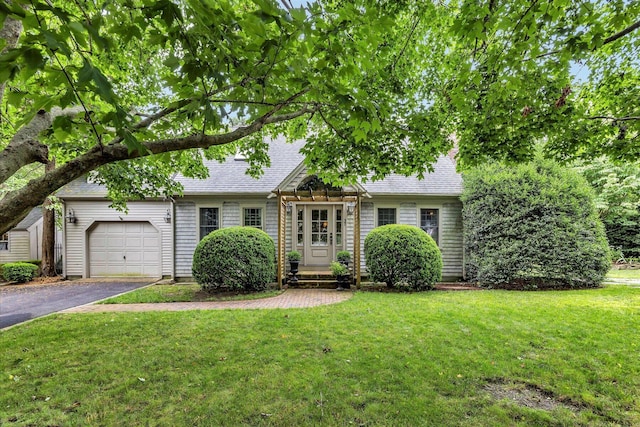 37 Tobisset St, Mashpee, MA 02649 - view of front of home featuring driveway, a garage, a shingled roof, and a front lawn