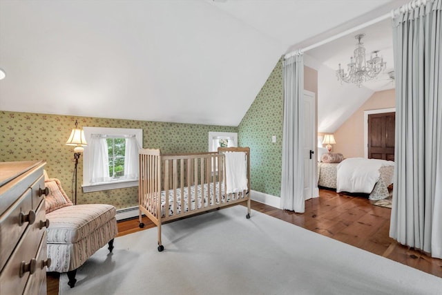 37 Tobisset St, Mashpee, MA 02649 - bedroom featuring vaulted ceiling, wallpapered walls, wood finished floors, a chandelier, and a baseboard radiator