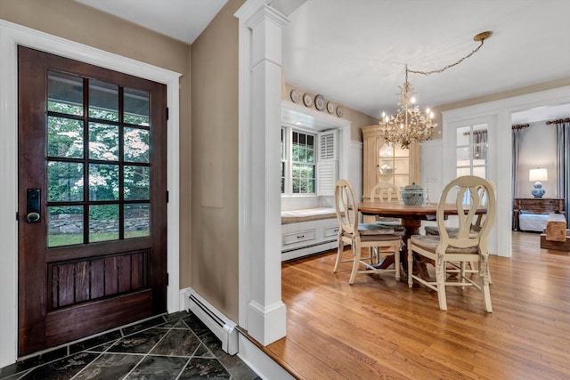 37 Tobisset St, Mashpee, MA 02649 - entrance foyer featuring a chandelier, a baseboard heating unit, and wood finished floors