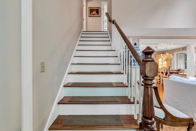 37 Tobisset St, Mashpee, MA 02649 - stairway with a chandelier and baseboards