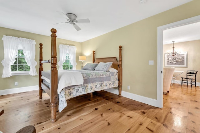 37 Tobisset St, Mashpee, MA 02649 - bedroom with a chandelier, wood-type flooring, and multiple windows