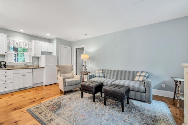 37 Tobisset St, Mashpee, MA 02649 - living room with light wood-style flooring and recessed lighting