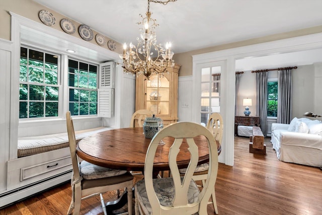 37 Tobisset St, Mashpee, MA 02649 - dining space with a chandelier, wood finished floors, and baseboard heating