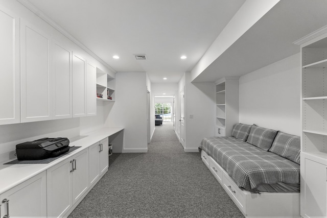 interior space featuring baseboards, recessed lighting, visible vents, and light colored carpet