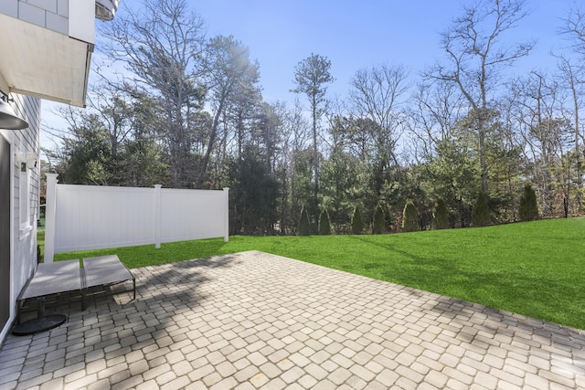 view of patio / terrace featuring fence