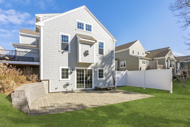 back of house with a patio area, a yard, and fence