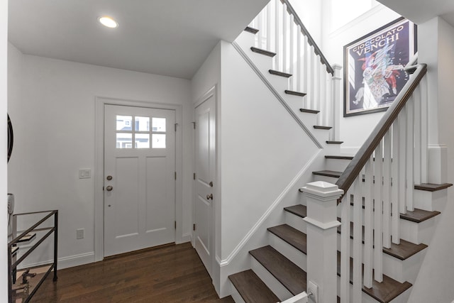 foyer entrance with baseboards, wood finished floors, and recessed lighting