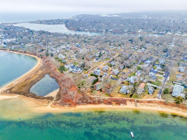 drone / aerial view featuring a residential view and a water view