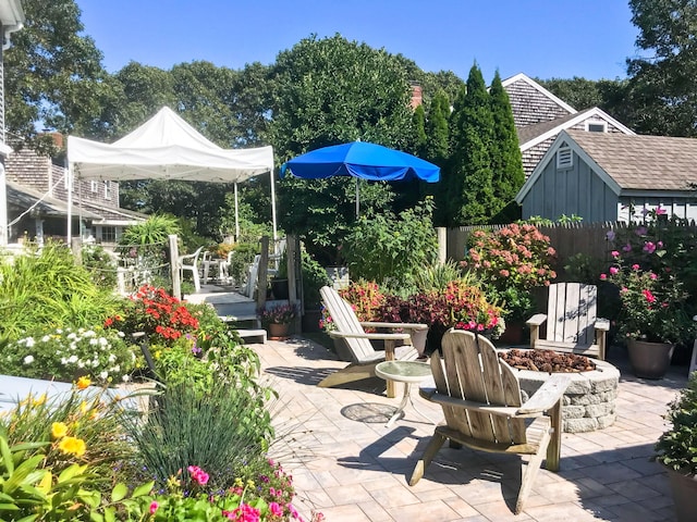 view of patio / terrace featuring a fire pit