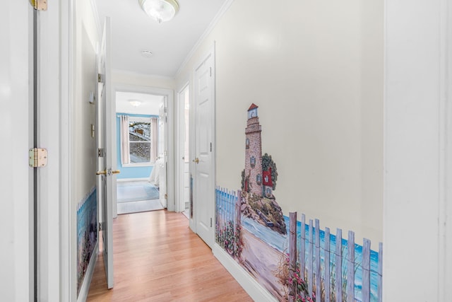 corridor featuring crown molding and light wood-type flooring