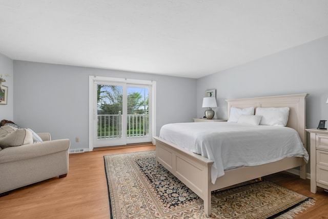 925 Main St Unit 3, Cotuit, MA 02635 - bedroom with access to outside and light wood finished floors