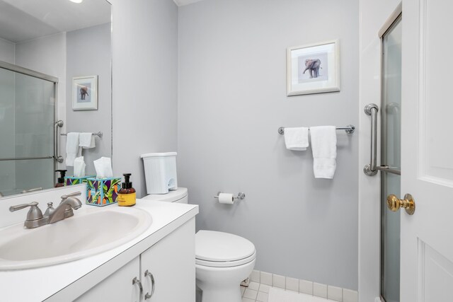 925 Main St Unit 3, Cotuit, MA 02635 - bathroom with a stall shower, tile patterned floors, vanity, and toilet