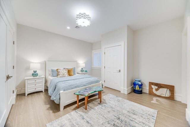 bedroom with light wood-type flooring