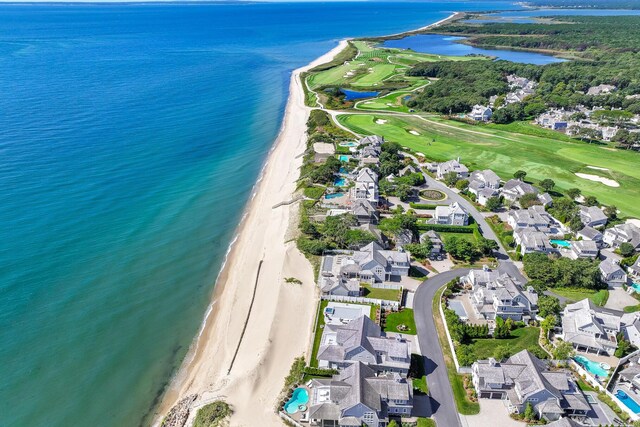 aerial view with a water view and a view of the beach