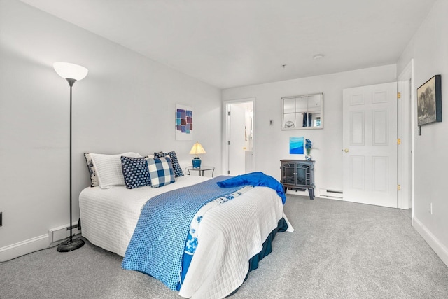 bedroom with carpet, baseboards, a baseboard heating unit, and baseboard heating