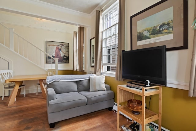 sitting room featuring hardwood / wood-style flooring and crown molding