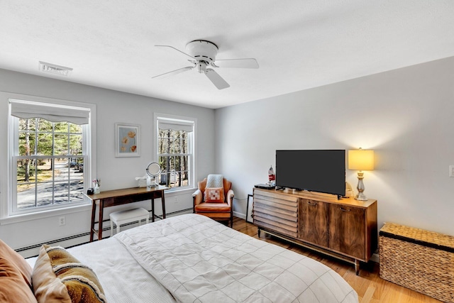 95 Red Brook Rd, Waquoit, MA 02536 - bedroom with visible vents, baseboards, a ceiling fan, and wood finished floors
