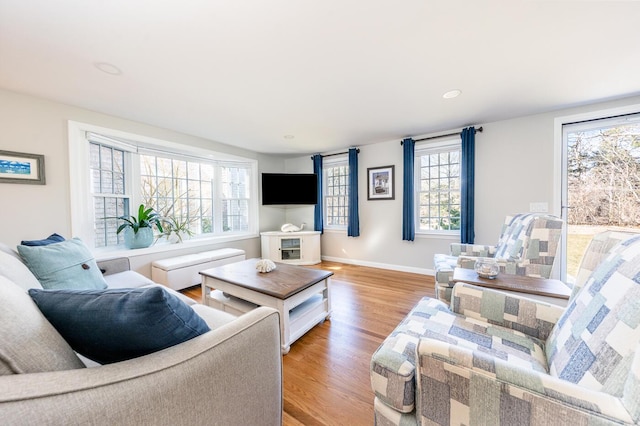 living room featuring light wood-style floors and baseboards