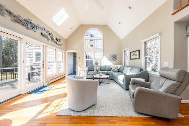 living room with a ceiling fan, a baseboard radiator, high vaulted ceiling, and wood finished floors