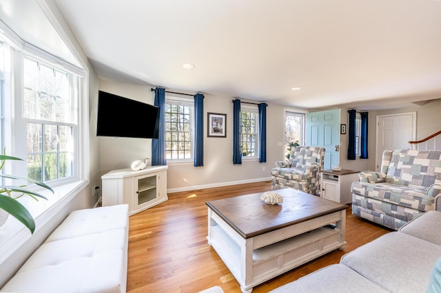 living room featuring light wood-style floors and baseboards