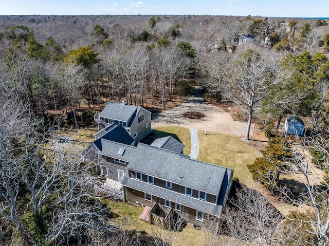 birds eye view of property with a forest view