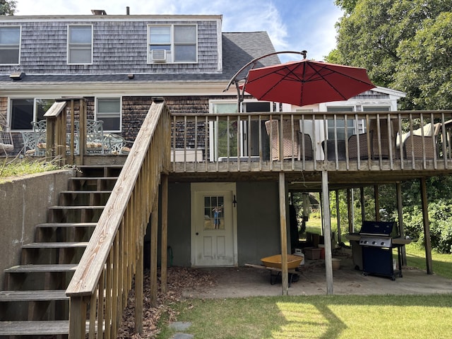 2 Shell Ln, Orleans, MA 02653 - back of property featuring stairway, a deck, a patio area, roof with shingles, and cooling unit