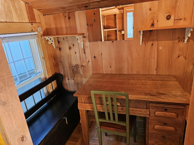 dining area with wooden walls