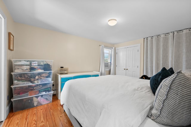 69 Upper County Rd, South Dennis, MA 02660 - bedroom featuring light wood-type flooring, a closet, and cooling unit