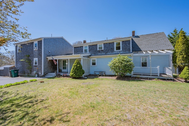 69 Upper County Rd, South Dennis, MA 02660 - back of house with a chimney, a lawn, a deck, and a pergola