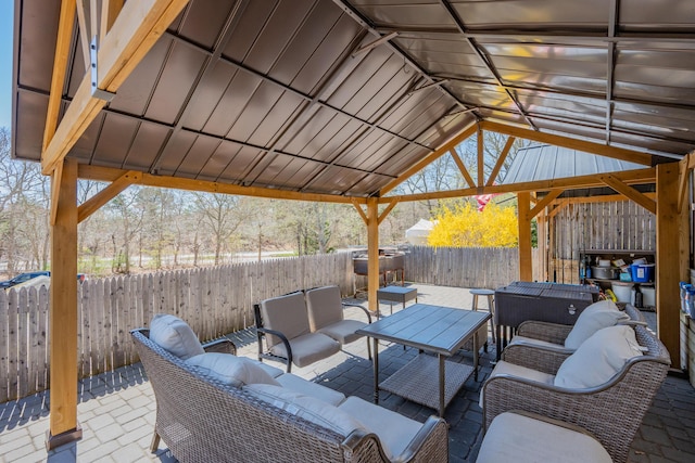 69 Upper County Rd, South Dennis, MA 02660 - fenced backyard featuring an outdoor hangout area, a patio, and a gazebo