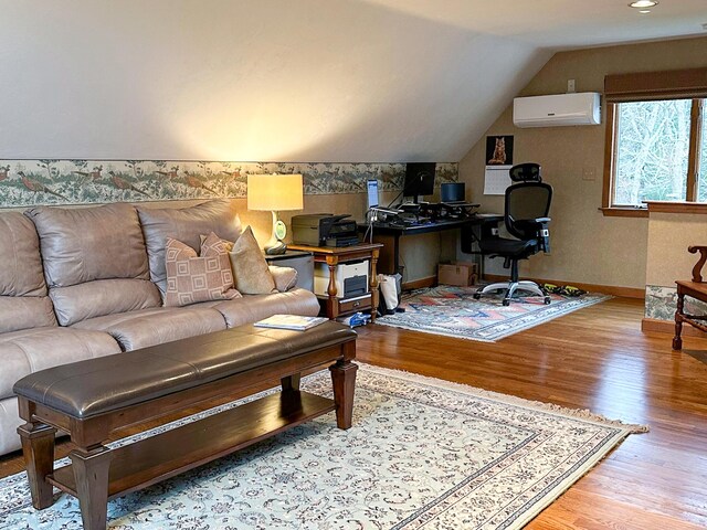 11 Polaris Dr, Mashpee, MA 02649 - living room with a wall mounted air conditioner, wood finished floors, vaulted ceiling, baseboards, and an office area