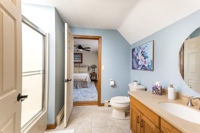 11 Polaris Dr, Mashpee, MA 02649 - ensuite bathroom with a baseboard heating unit, vanity, toilet, vaulted ceiling, and baseboards