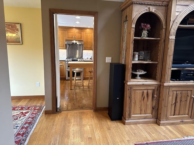 11 Polaris Dr, Mashpee, MA 02649 - bar with range with two ovens, light wood-style floors, baseboards, recessed lighting, and under cabinet range hood