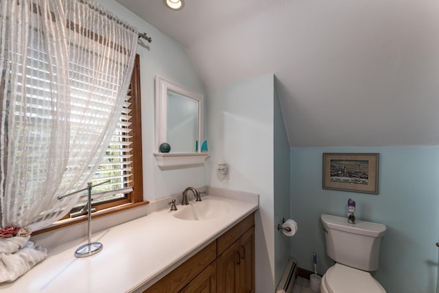 11 Polaris Dr, Mashpee, MA 02649 - bathroom with vaulted ceiling, a baseboard heating unit, vanity, and toilet