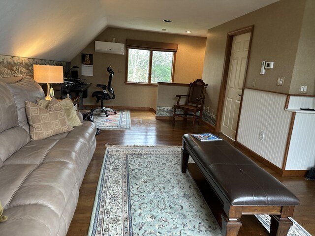 11 Polaris Dr, Mashpee, MA 02649 - living area featuring a wall mounted air conditioner, wood finished floors, baseboards, and vaulted ceiling
