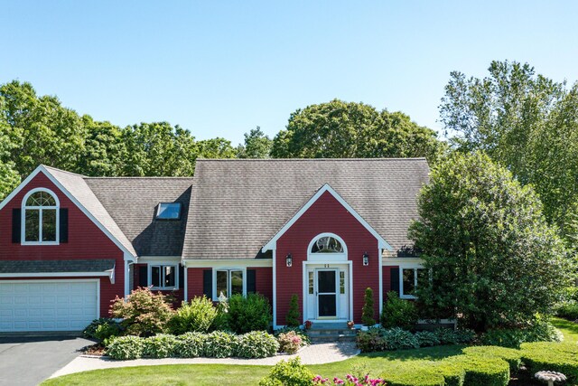 11 Polaris Dr, Mashpee, MA 02649 - view of front facade with a garage, a front yard, and asphalt driveway