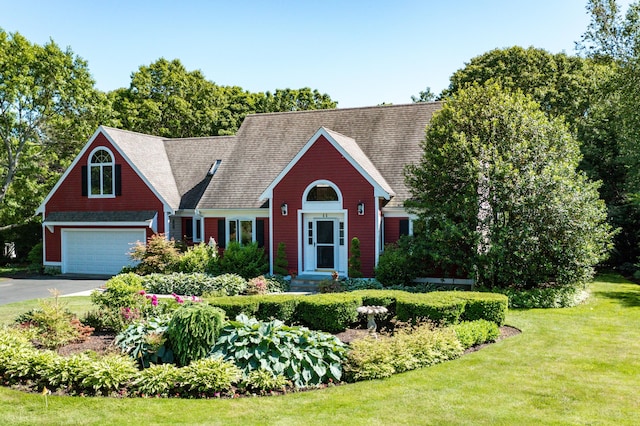 11 Polaris Dr, Mashpee, MA 02649 - view of front of home featuring asphalt driveway, a front yard, and an attached garage
