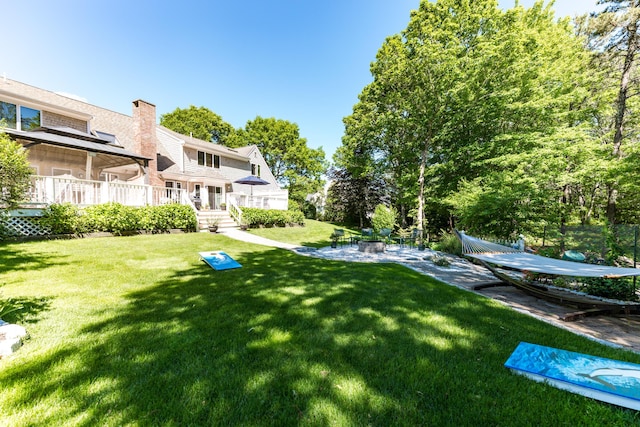 11 Polaris Dr, Mashpee, MA 02649 - view of green lawn featuring a patio area