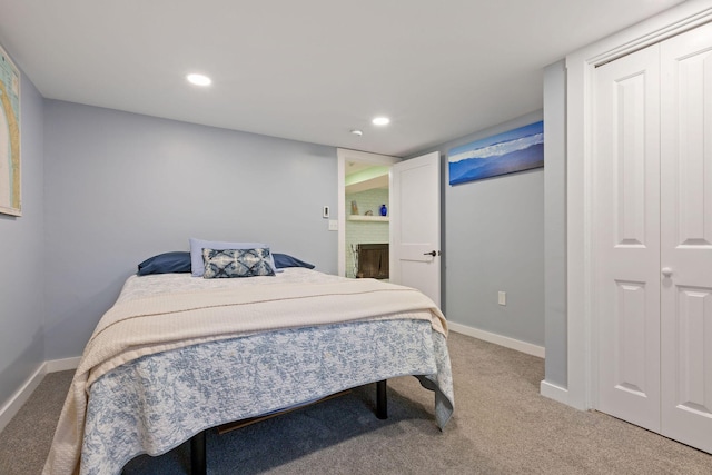 bedroom with a closet and carpet flooring