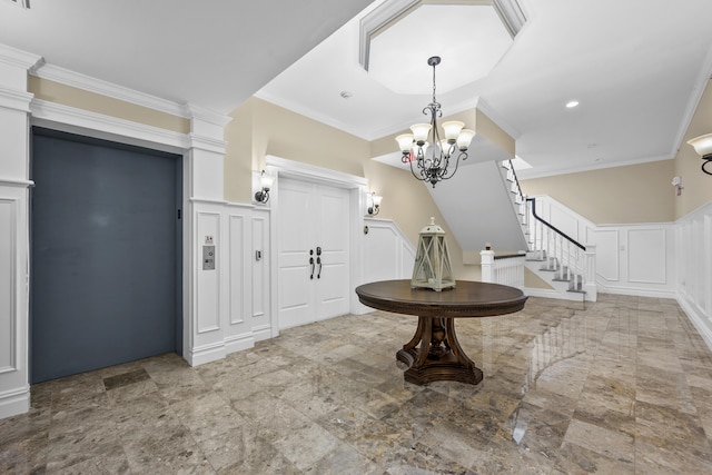 595 Main St Unit 37, Chatham, MA 02633 - foyer entrance with a decorative wall, stairs, ornamental molding, a chandelier, and stone finish flooring