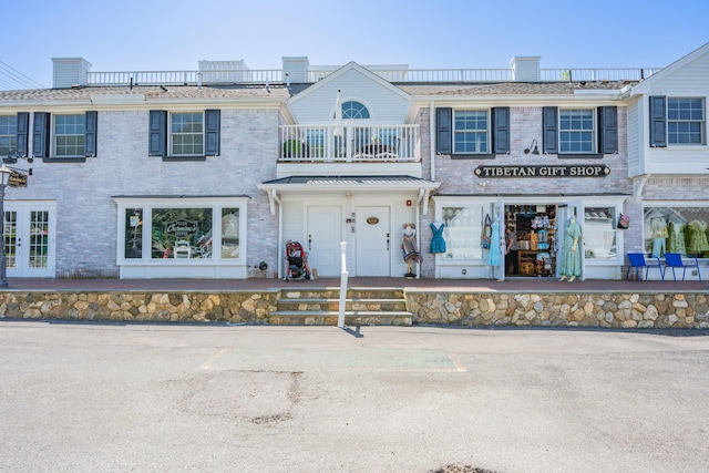 595 Main St Unit 37, Chatham, MA 02633 - view of front of house with a balcony, french doors, and brick siding