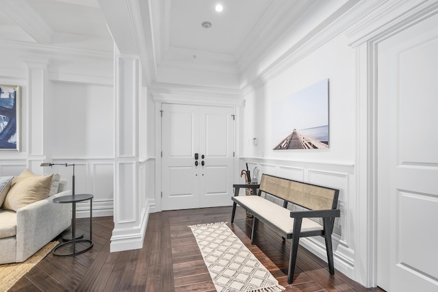 595 Main St Unit 37, Chatham, MA 02633 - entrance foyer featuring a decorative wall, decorative columns, crown molding, dark wood-type flooring, and wainscoting