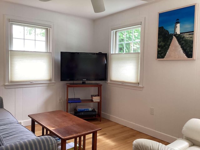 8 Saco Ave, Pocasset, MA 02559 - living room with healthy amount of natural light, light wood-style flooring, a decorative wall, and a ceiling fan