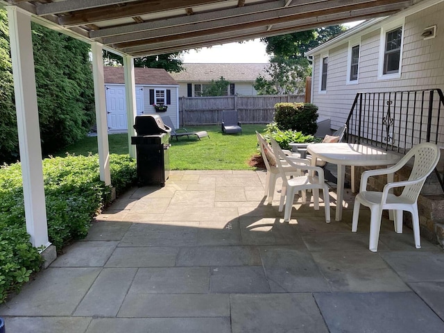 8 Saco Ave, Pocasset, MA 02559 - view of patio / terrace featuring a storage unit, outdoor dining area, and grilling area