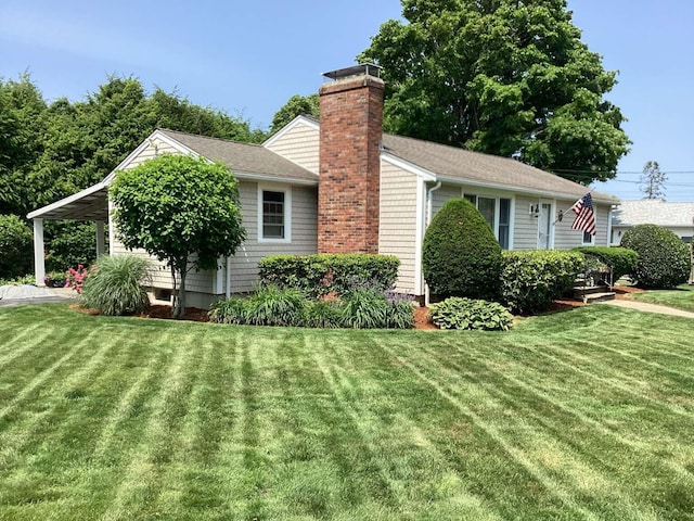 8 Saco Ave, Pocasset, MA 02559 - view of side of property featuring a chimney, a yard, and roof with shingles